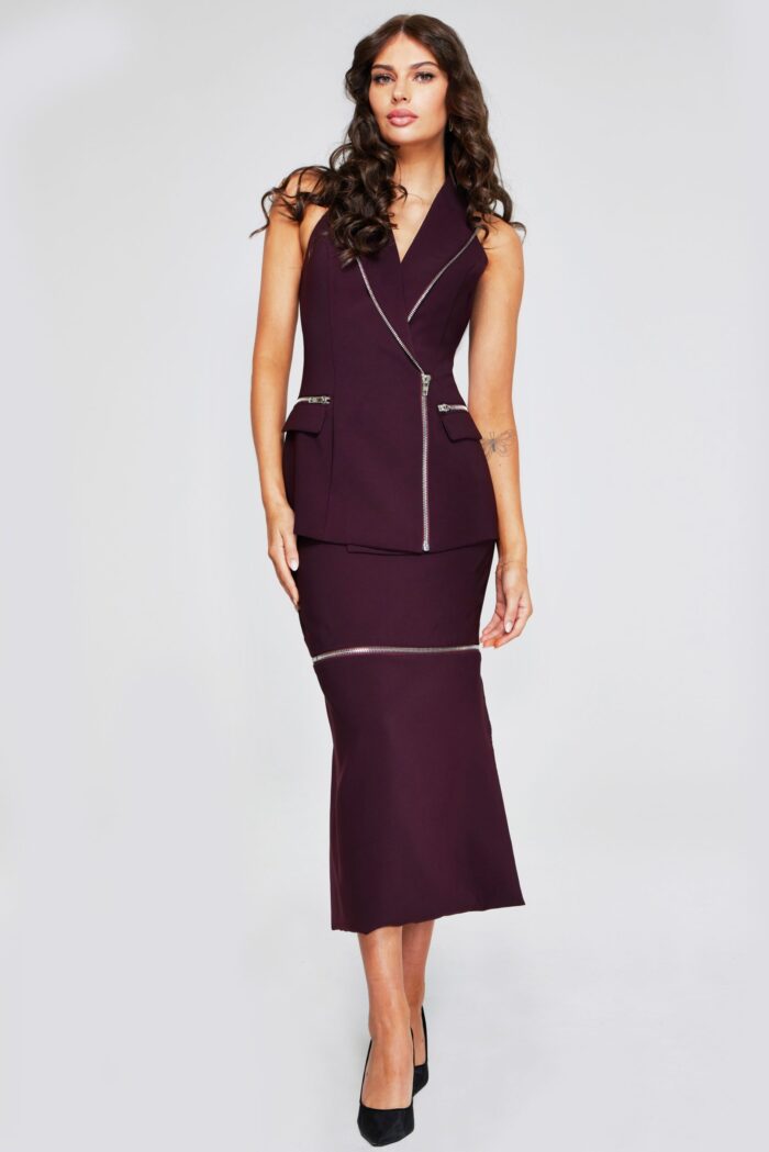 Model wearing Jovani 39802 plum dress with V-neckline and zipper details