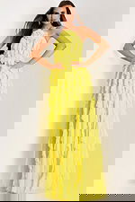 Ruffled yellow dress with high slit and soft flow