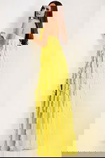 back of yellow ruffled dres