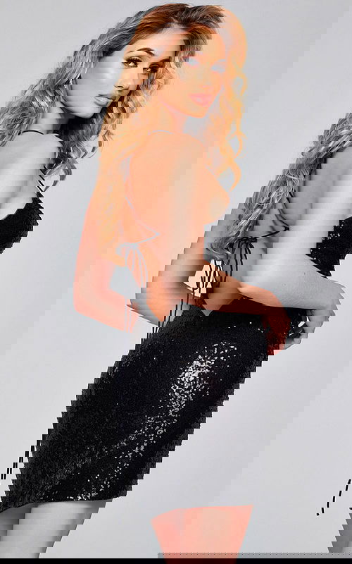 Back view of model wearing Jovani 39844 black dress with lace-up detail.