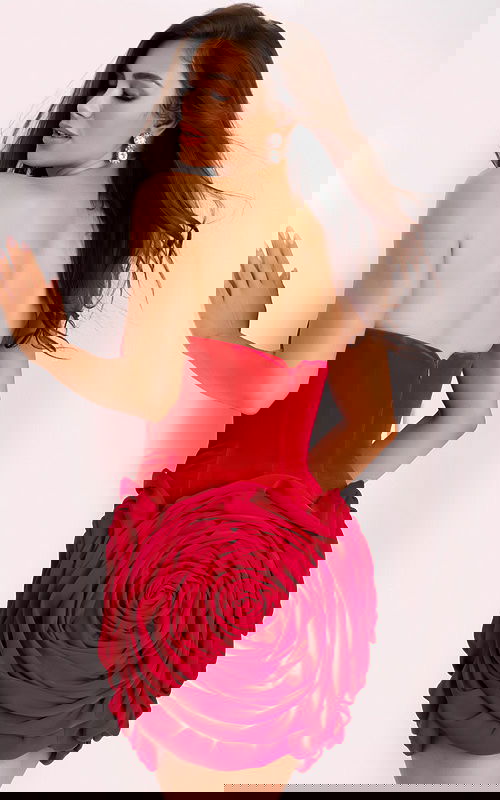 Back view of red mini dress with large rose design