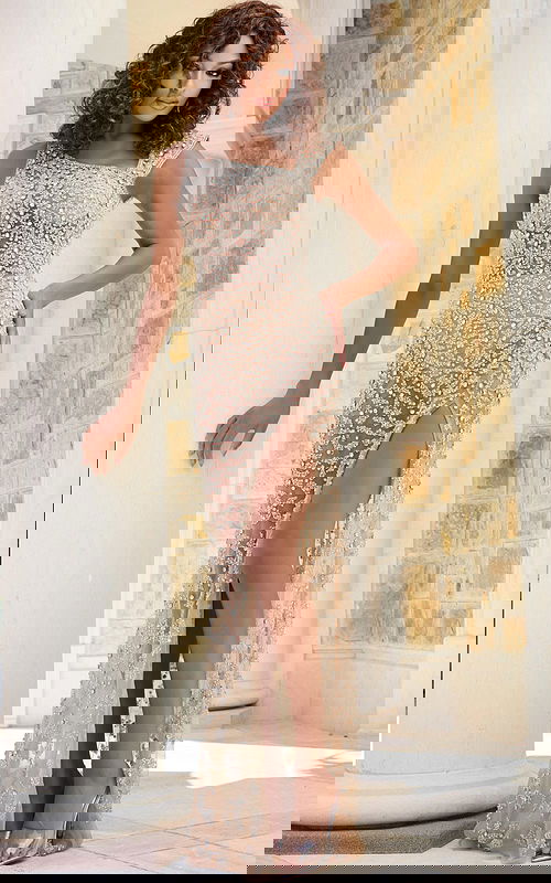 Model wearing Jovani 39849 nude beaded gown, showcasing front details.