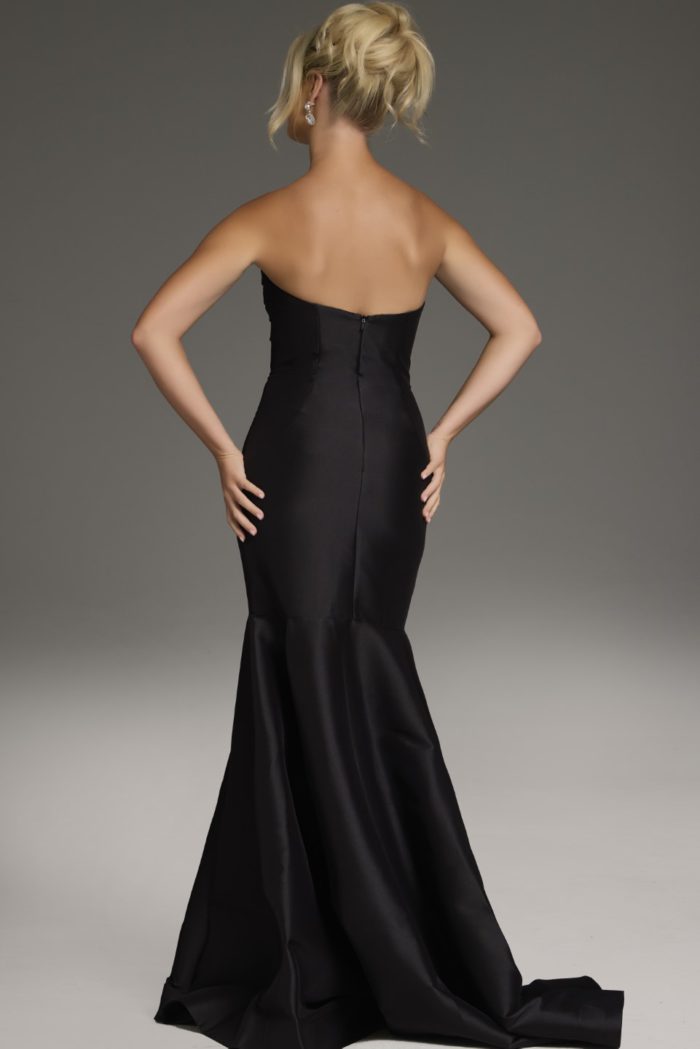 Model wearing Jovani 39872 black mermaid gown back view