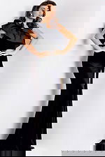 Black velvet one-shoulder evening gown with ruffle and slit