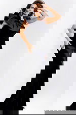 Side view of black mermaid gown with bold ruffled neckline