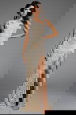 Elegant gown featuring a high slit and detailed beading