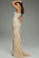 Side view of an intricately beaded one-shoulder gown