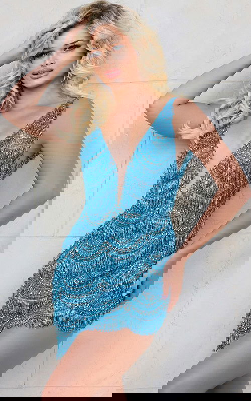 Model wearing Jovani 39909 blue mini dress with deep V-neckline and fringe details, front view.