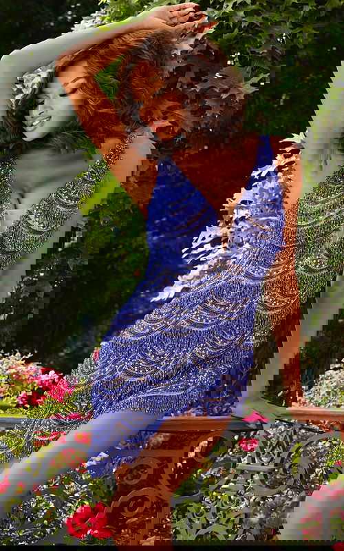 Model wearing Jovani 39909 in royal blue with V-neckline and beaded details.