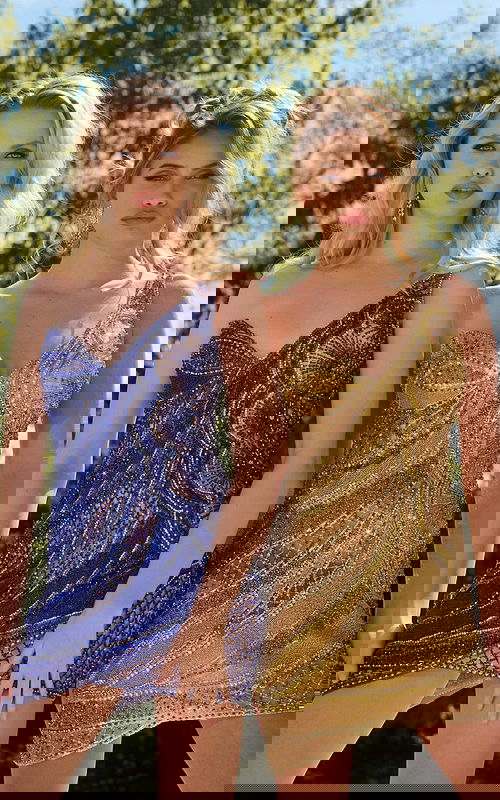 Model duo wearing Jovani 39914 dress with detailed bead embellishments in nude.