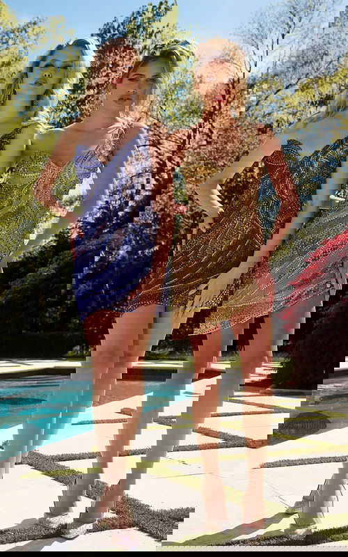 Model wearing Jovani 39914 mini dress featuring intricate beadwork in nude.