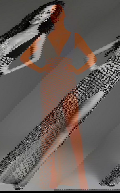 Model wearing Jovani 39917 black gown with intricate detailing and a high slit, front view.