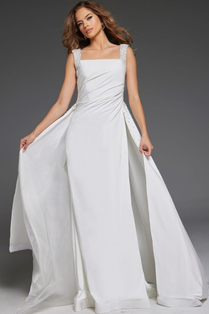 Model wearing Jovani 39921 elegant floor-length white gown with square neckline and embellished straps