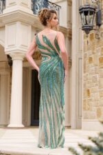 Model wearing Jovani 39943 green gown, back view.