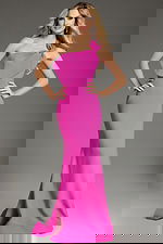 Model wearing Jovani 39971 pink gown with one-shoulder neckline and bow detail.