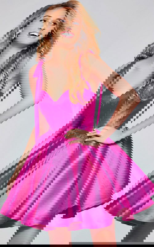 Model wearing Jovani 39979 pink dress with sweetheart neckline and tied shoulders.