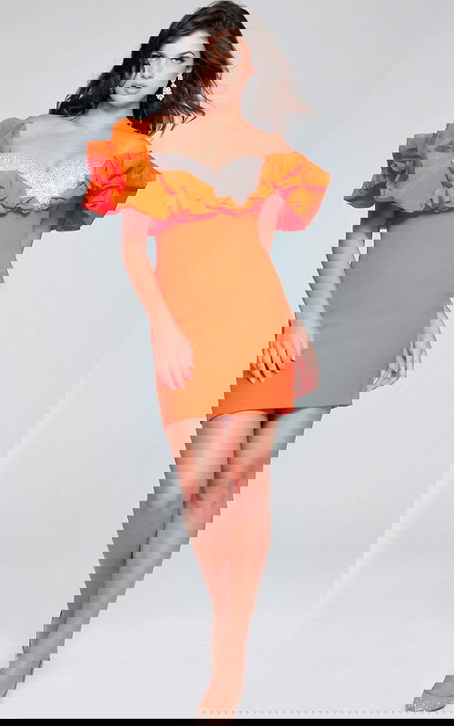 Model wearing Jovani 39985 full view of orange ruffled dress.