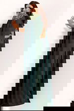 Back view of green formal cape gown with jeweled shoulders