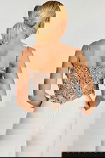 Back view of silver embellished crop top with zipper closure and sequin straps.