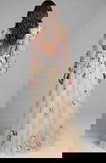 Open back floral embroidered long sleeve evening gown with flowing skirt