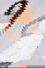 Model wearing Jovani 40030 white dress with a strapless design and tiered skirt, front view close-up.