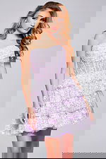 Model in Jovani 40030 lilac dress showing strapless design with a playful tiered skirt, front view.