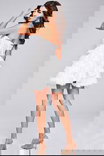 Model wearing Jovani 40030 white dress with a strapless neckline, viewed from the back.