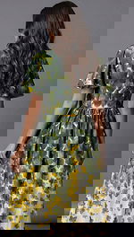 Back view of a long floral evening dress with flutter sleeves and a softly gathered waist