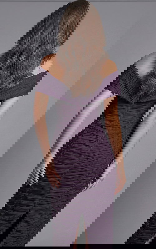 Back view of an off the shoulder fitted evening dress with ruched fabric and center back slit