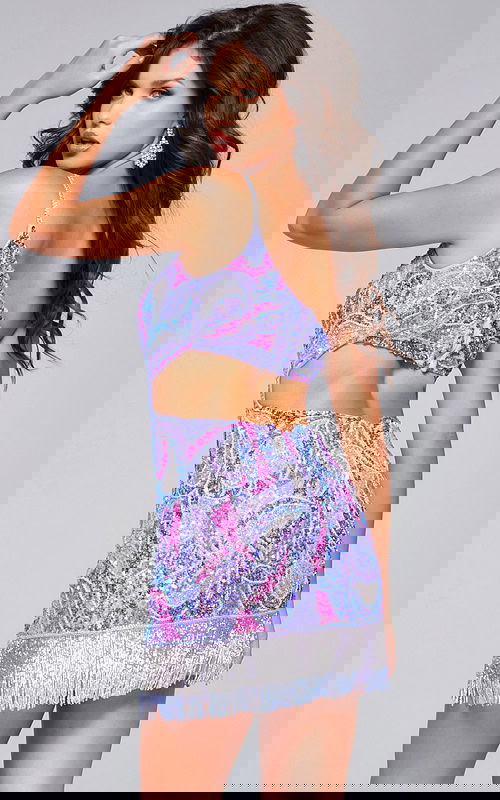 Model showcasing back of Jovani 40076 pink mini dress with cut-out detail and sequin design.