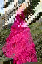 Elegant strapless gown with sheer overlay and voluminous floral details