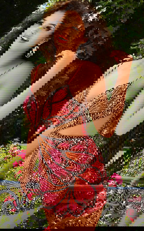 Model showcasing Jovani 40130 beaded mini dress with cut-out detail, another front view.