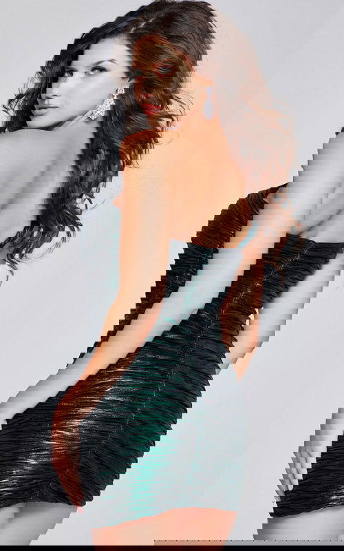 model wearing 40136 green mini dress with textured back view