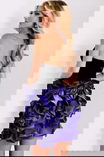 Back of mini dress showing zipper and layered rosette detail