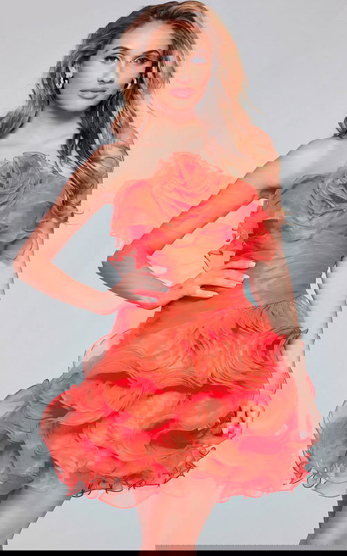 Model wearing Jovani 40144 orange dress showcasing the back view