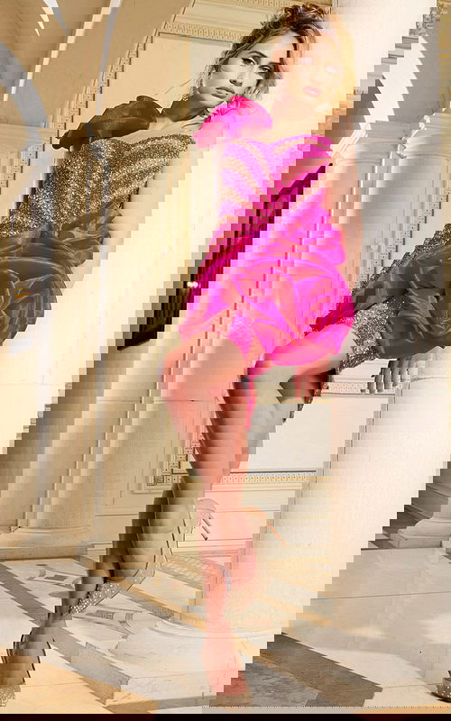 Model wearing Jovani 40172 fuchsia dress front view with ruffle detail.