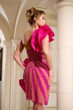 Model wearing Jovani 40172 fuchsia dress back view showing shoulder ruffle.