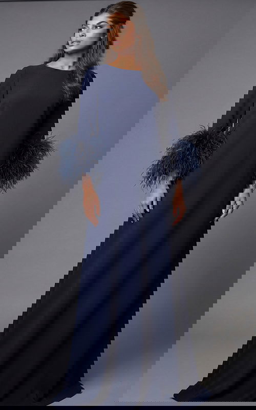 Floor-length navy gown with feather-trim sleeves and clean back silhouette