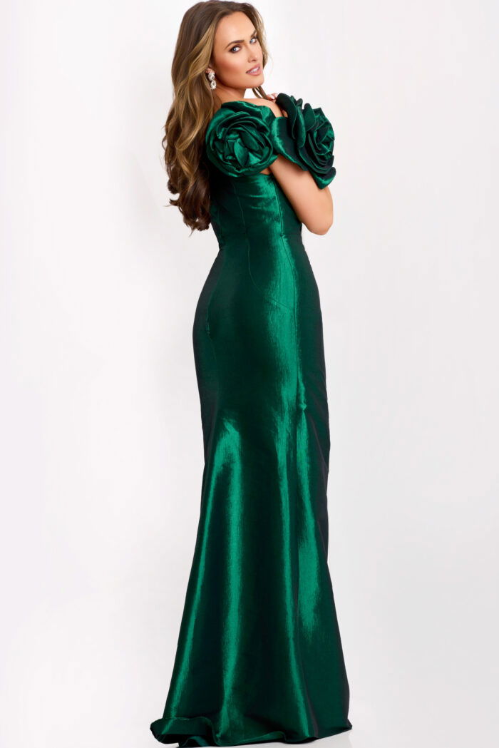 Back view of fitted green formal gown with rosette sleeves
