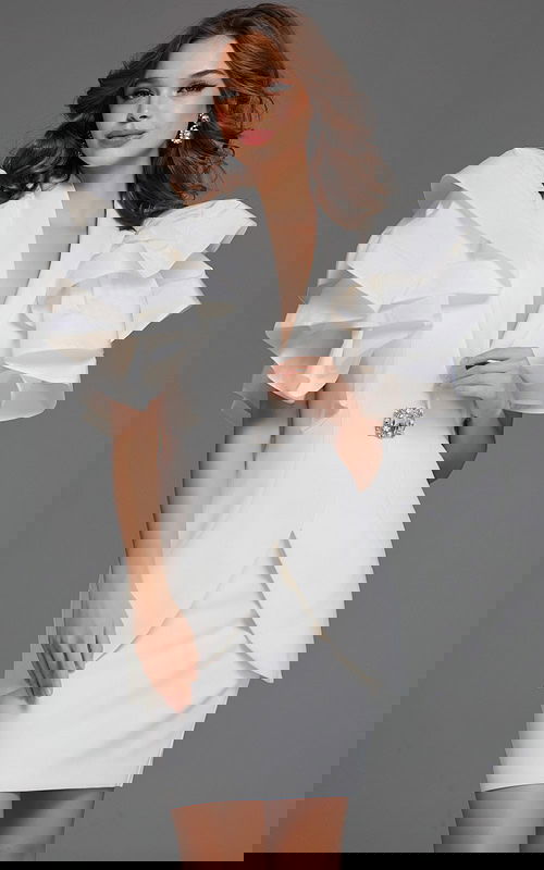 Model wearing Jovani 40292 ivory dress with ruffled sleeves, front view.