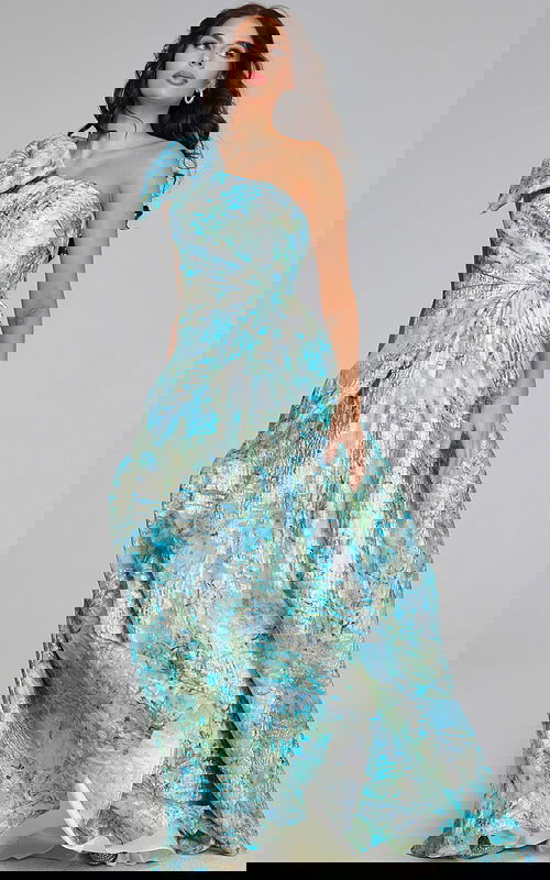 Model wearing Jovani 40317 mint multi dress with one-shoulder neckline and bow detail.