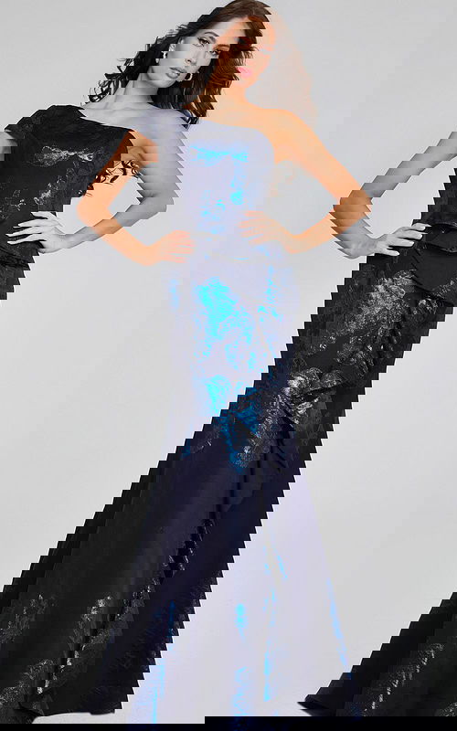 Model wearing Jovani 40320 navy gown with one-shoulder neckline and ruffle details, front view.