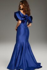 Model wearing Jovani 40324 purple mermaid gown with ruffle details, back view