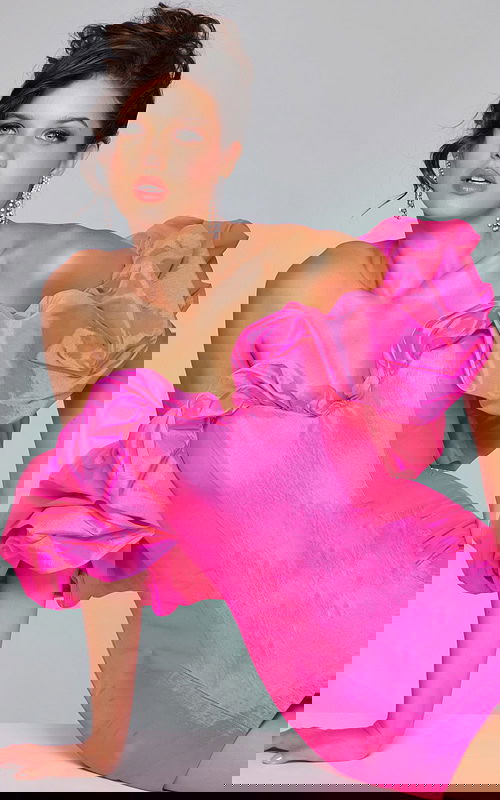 model wearing Jovani 40378 pink dress with off-the-shoulder ruffled sleeves, back view