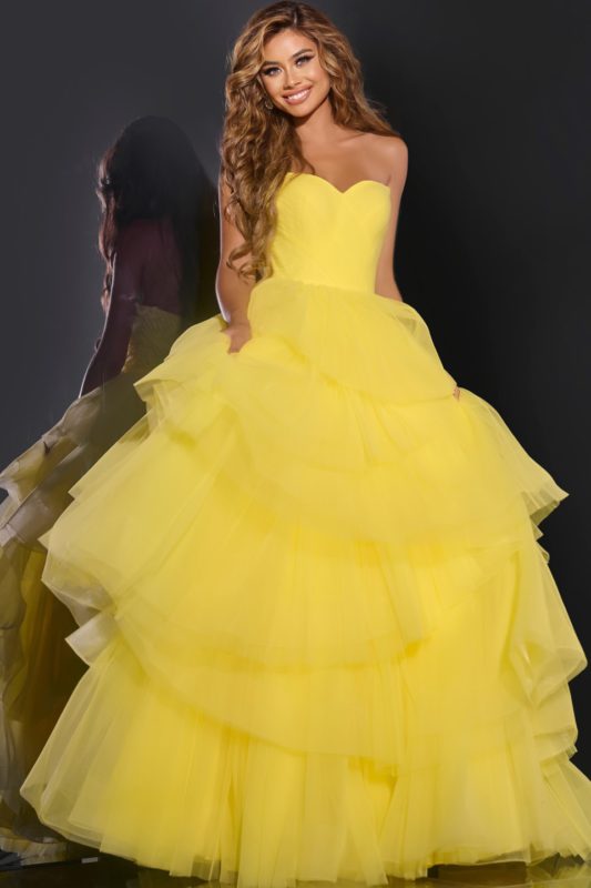 Model showcasing the front view of Jovani 40394 yellow ball gown.
