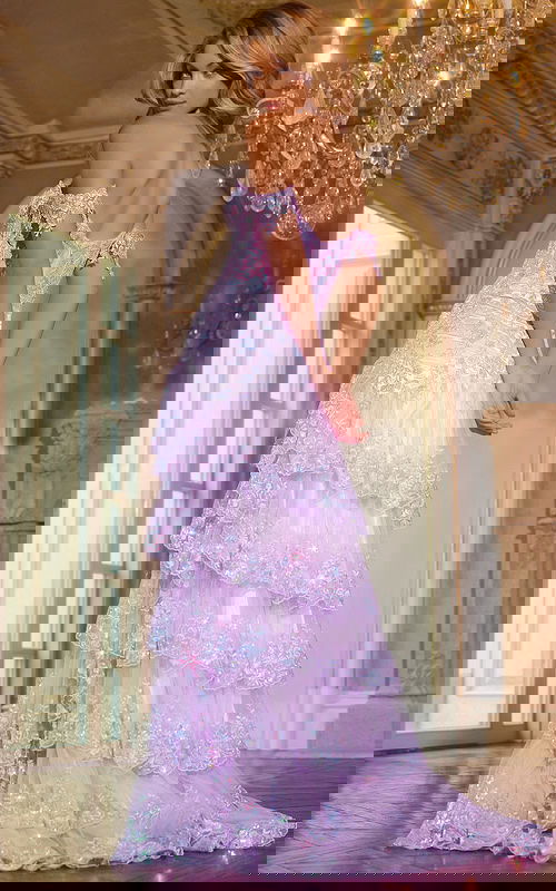 Back view of model wearing Jovani 40397 lilac gown with tiered skirt