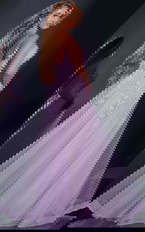 Model wearing Jovani 40472 lilac gown, showing back detail with floral appliques.