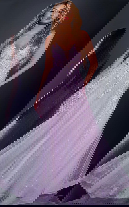 Model wearing Jovani 40472 lilac gown with floral appliques and V-neckline, front view.