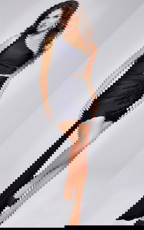 model wearing Jovani 40477 black one-shoulder cocktail dress with side sash