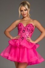 Model wearing Jovani 40503 pink dress with sweetheart neckline and layered skirt.
